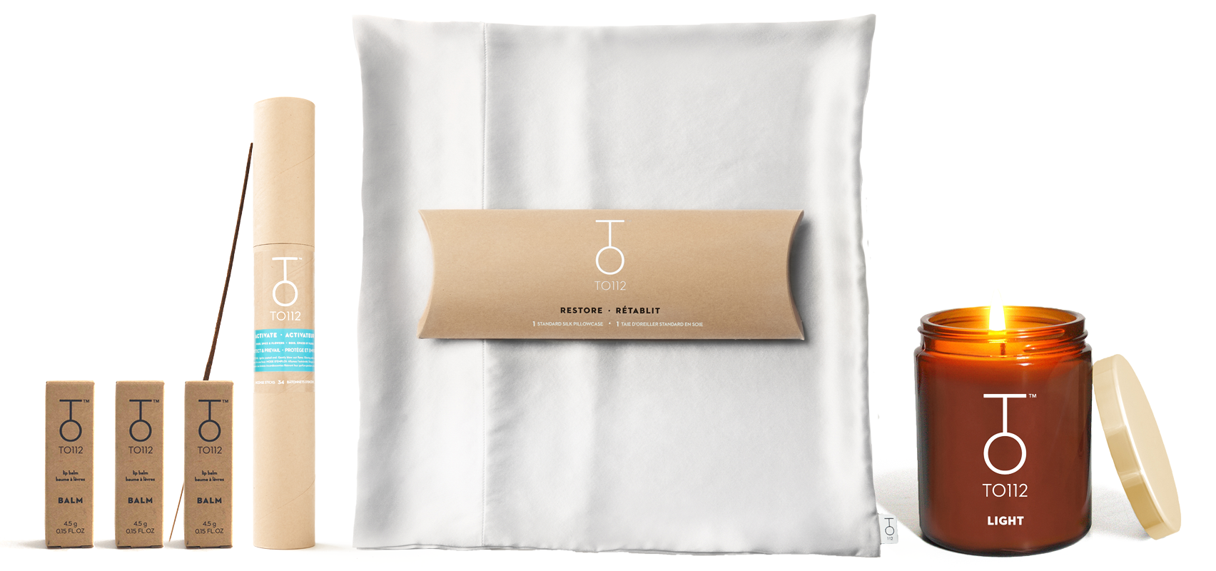TO112 lip balm, TO112 incense, TO112 restore silk pillowcase and TO112 palo santo candle on white background