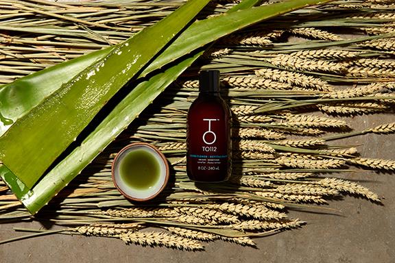 8oz bottle of To112 conditioner for normal hair with aloe and wheat grass beside product bottle