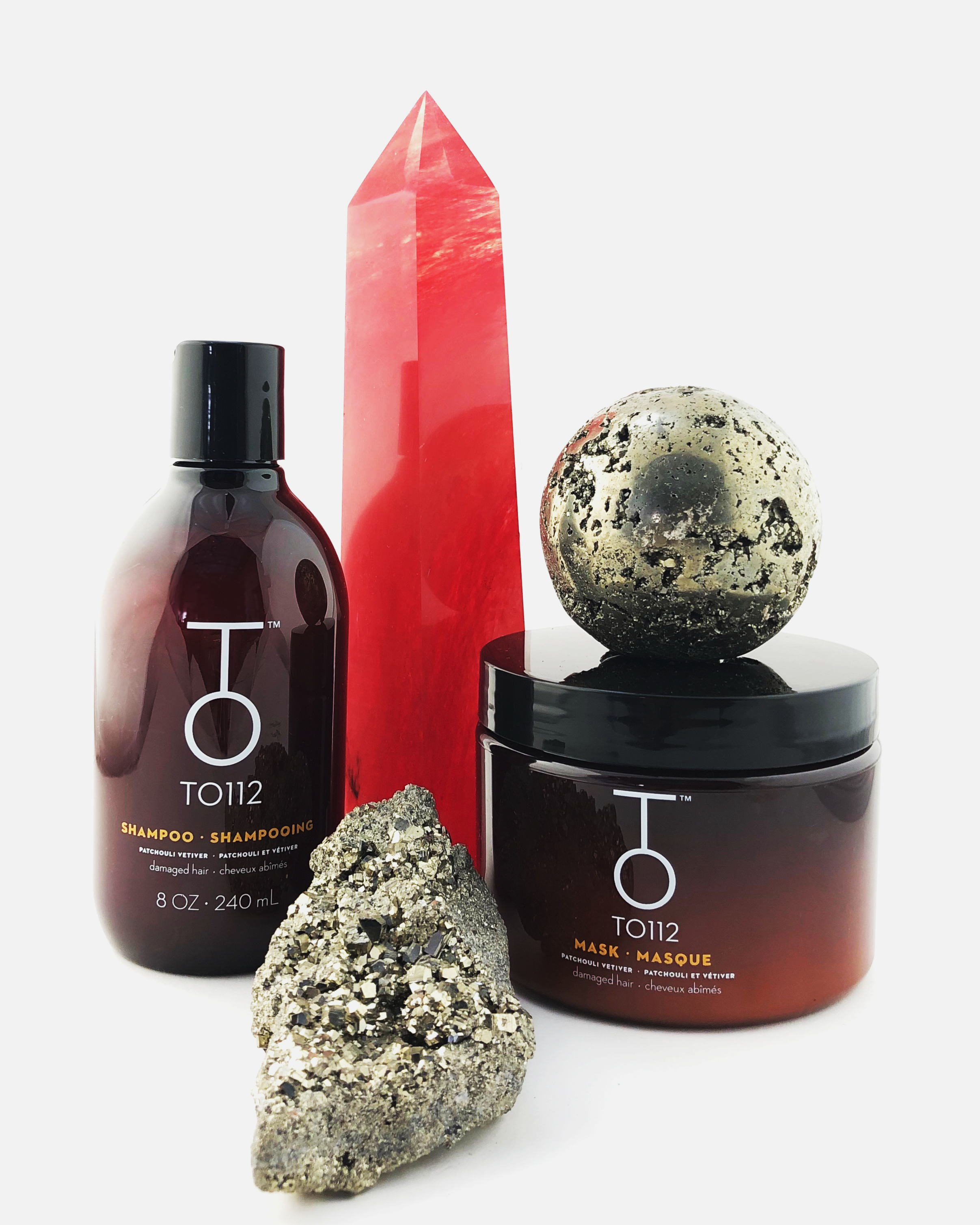 TO112 biotin shampoo for damaged hair and TO112 collagen mask surrounded with red and gold crystals
